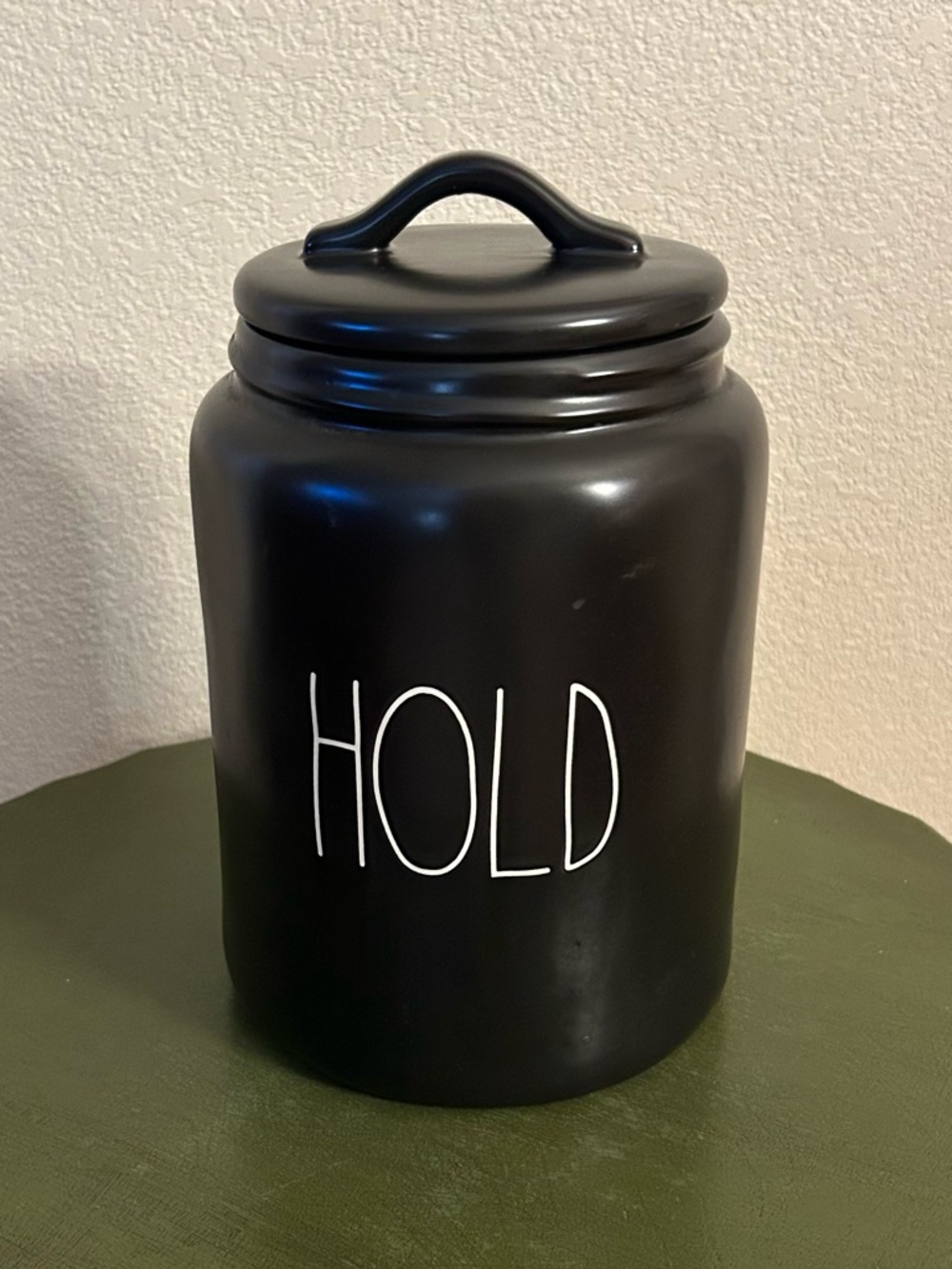 Rae Dunn Black Ceramic Canister with White 'HOLD' Lettering